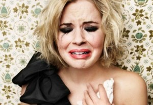 Crying but glamorous and with clothes falling off